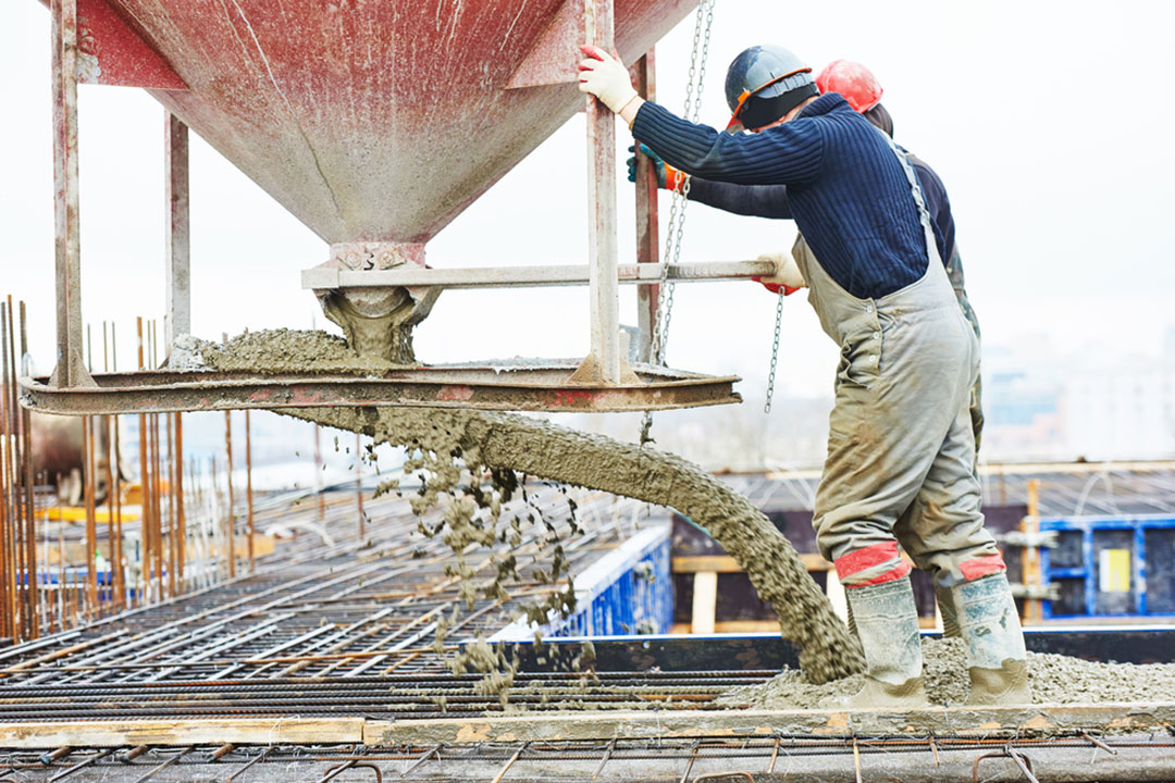 Foundation repair crew installing piers